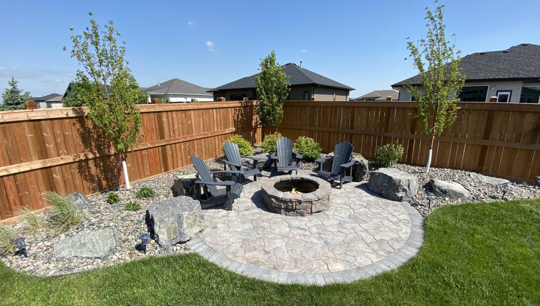 Front yard with paver driveway and walkway showing strong curb appeal in Southeast Michigan