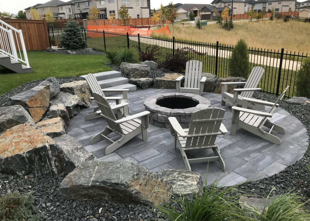 Home with paver pathway, landscape lighting, and tidy curb appeal in Michigan