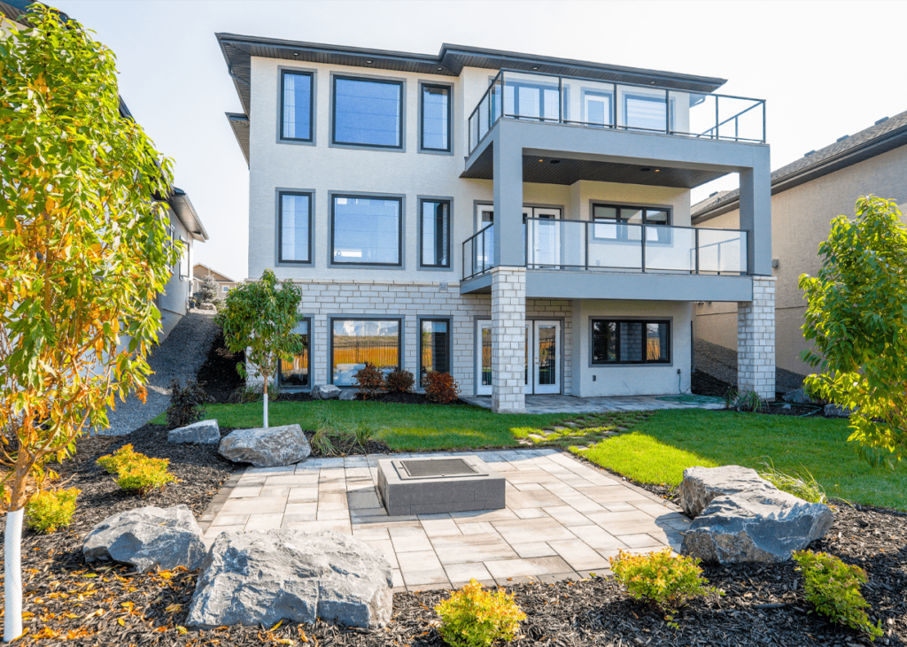 Professional crew completing a residential hardscape and landscaping project